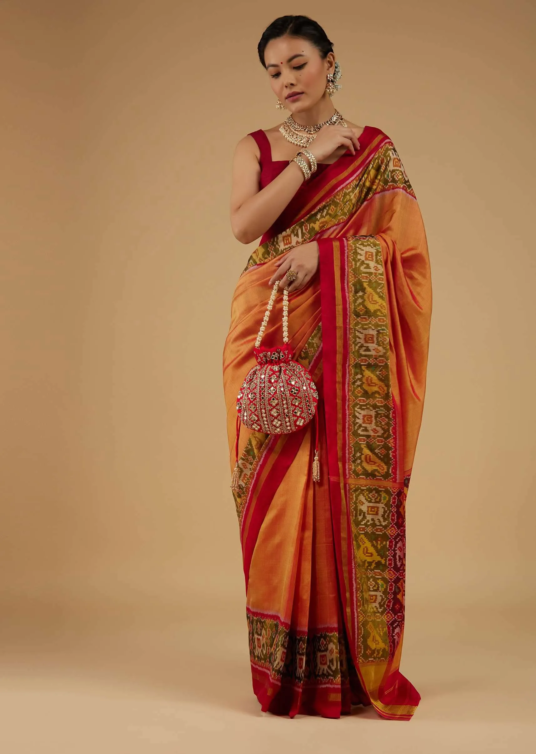 Carrot Orange Saree In Silk With Ikat Weave Patola Work