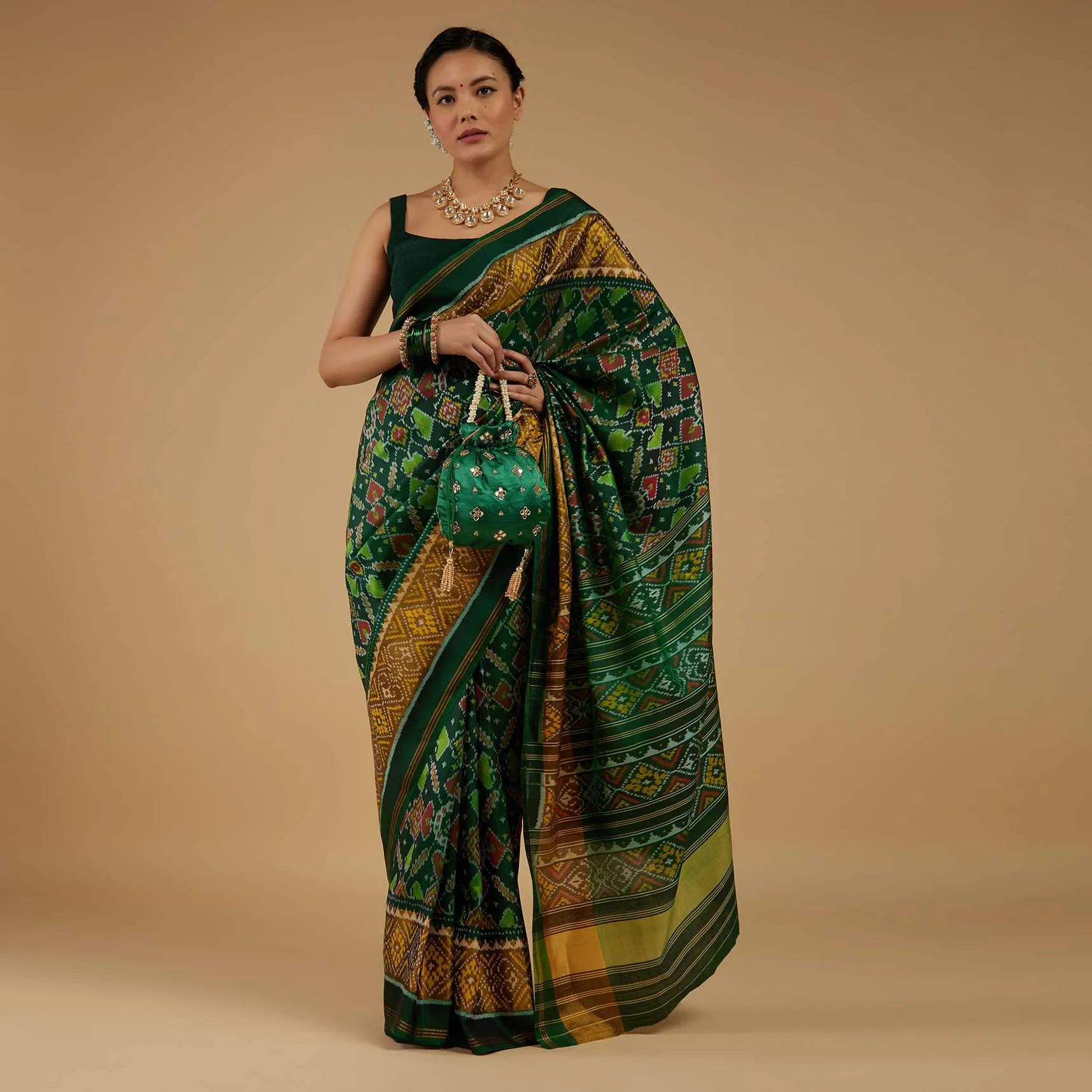 Deep Green Saree In Silk With Ikat Weave Patola Work